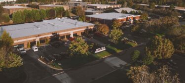 Aerial view of WEIMA's campus at sunrise