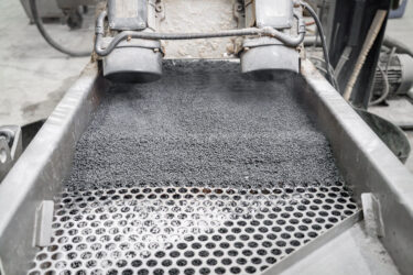 At the end of the recycling line, you can see the finished black regranulate