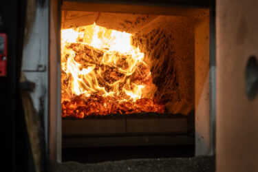 Wood chips are burned in a biomass heating system