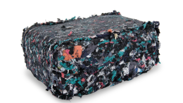 Briquette made from shredded textiles