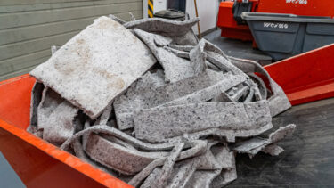 In a box, you can see non-woven fabrics before they are shredded