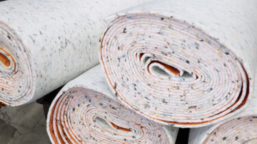 White painter’s fleece with colourful dots, stacked in rolls on top of one another