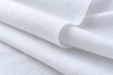 White fabric waves made of nonwoven (generated by AI)